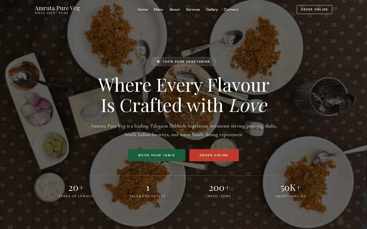 Amruta Pure Veg homepage with dining photography and table booking actions