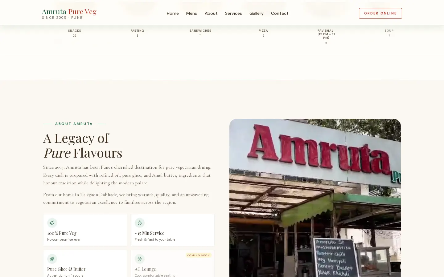 Amruta Pure Veg story section alongside a photograph of the restaurant exterior